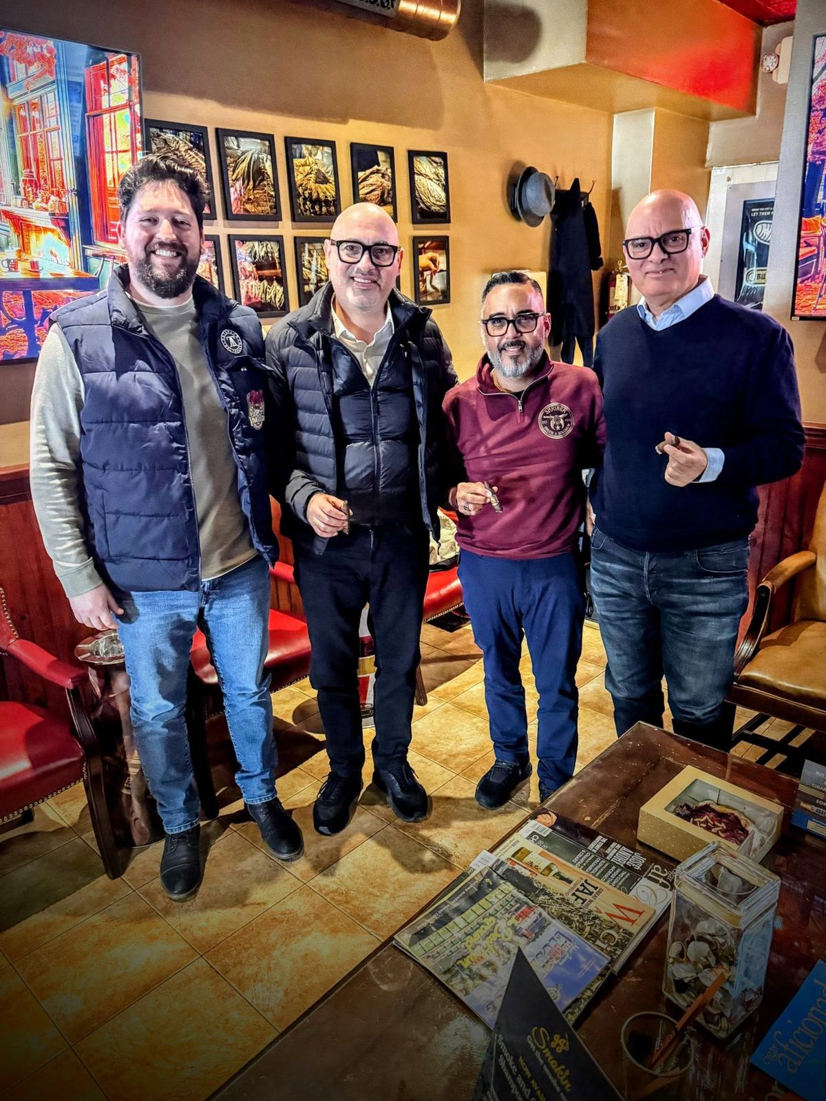 Four friends with cigars in the Mane Street Cigars lounge